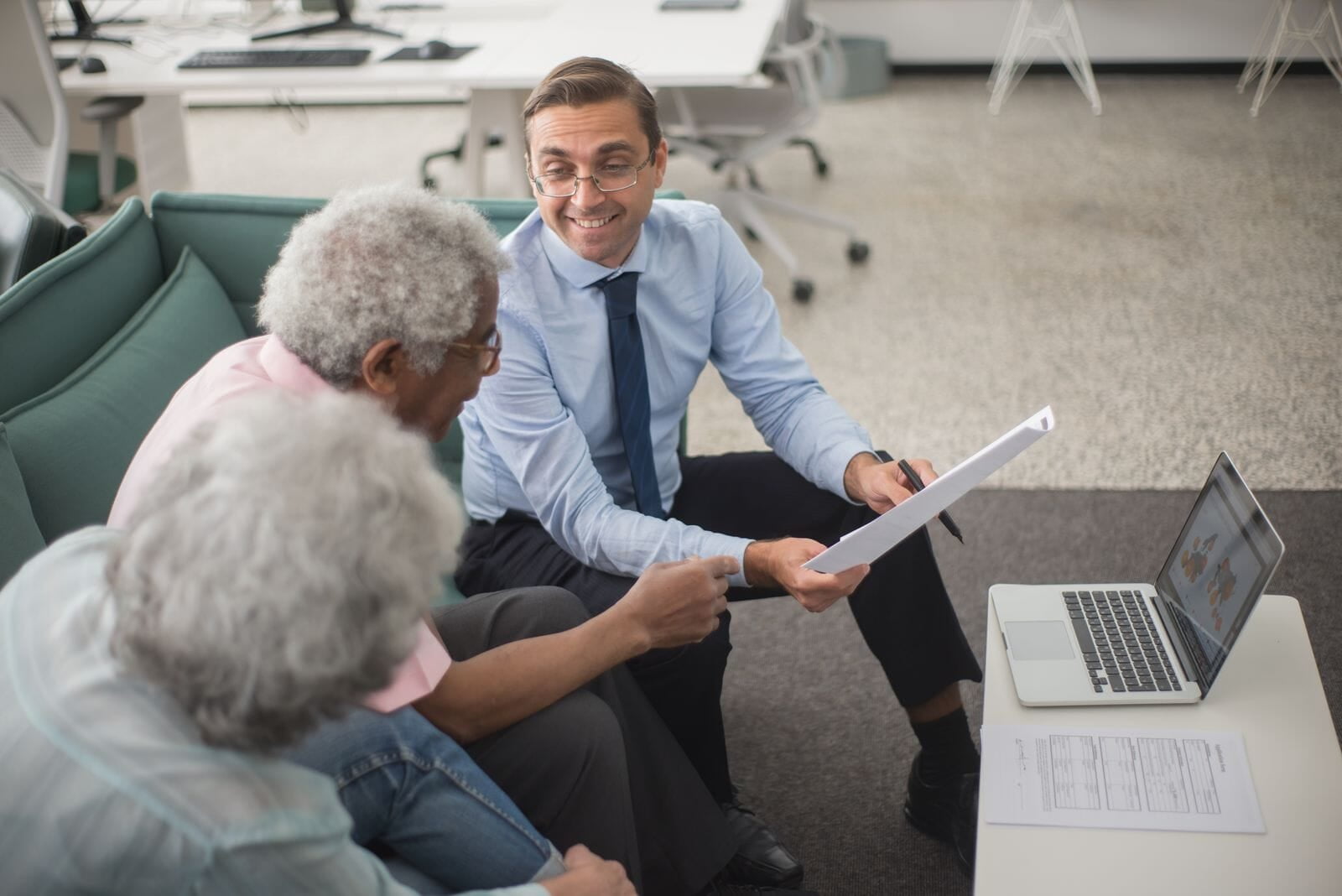 IT consultant reviewing technology plans with small business owners