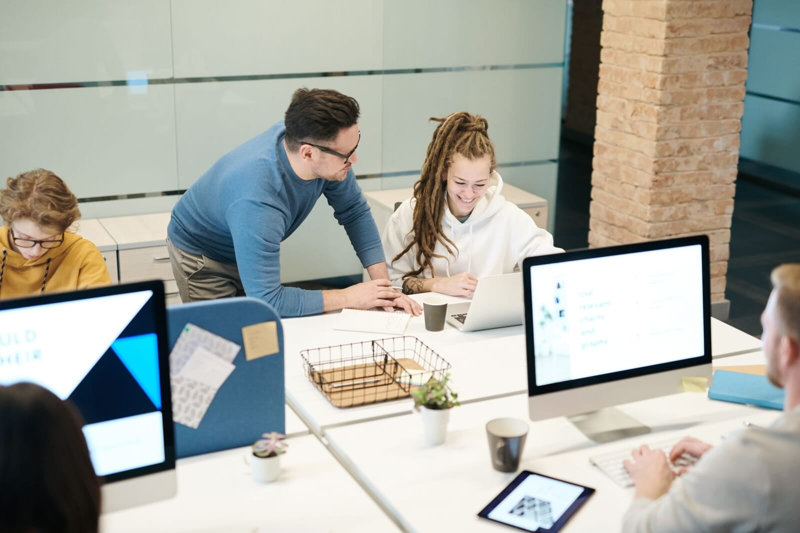 IT professional helping a small business team at their computers